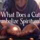 Feature image of a person with a glowing cut on their palm, surrounded by spiritual artifacts, with the title "What Does a Cut Symbolize Spiritually?" prominently displayed.