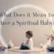 A serene room with a person surrounded by crystals, candles, and flowers, with the title "What Does It Mean to Have a Spiritual Baby?" displayed prominently, symbolizing spiritual growth and new beginnings.